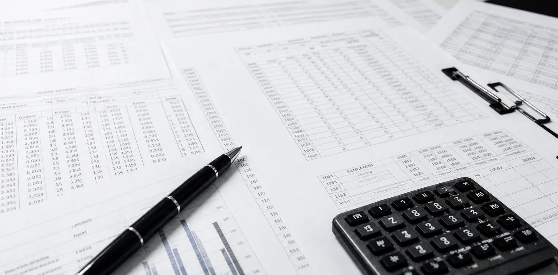 Open financial ledger and papers on a desk