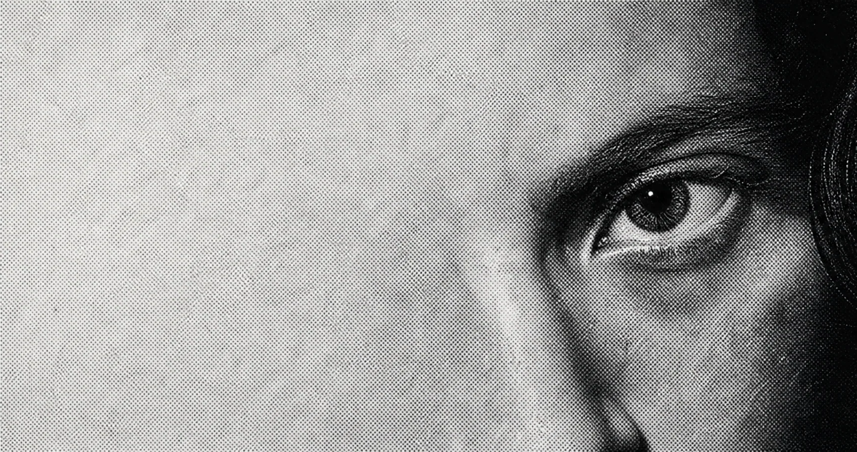 Close-up of an eye in a black and white printed image