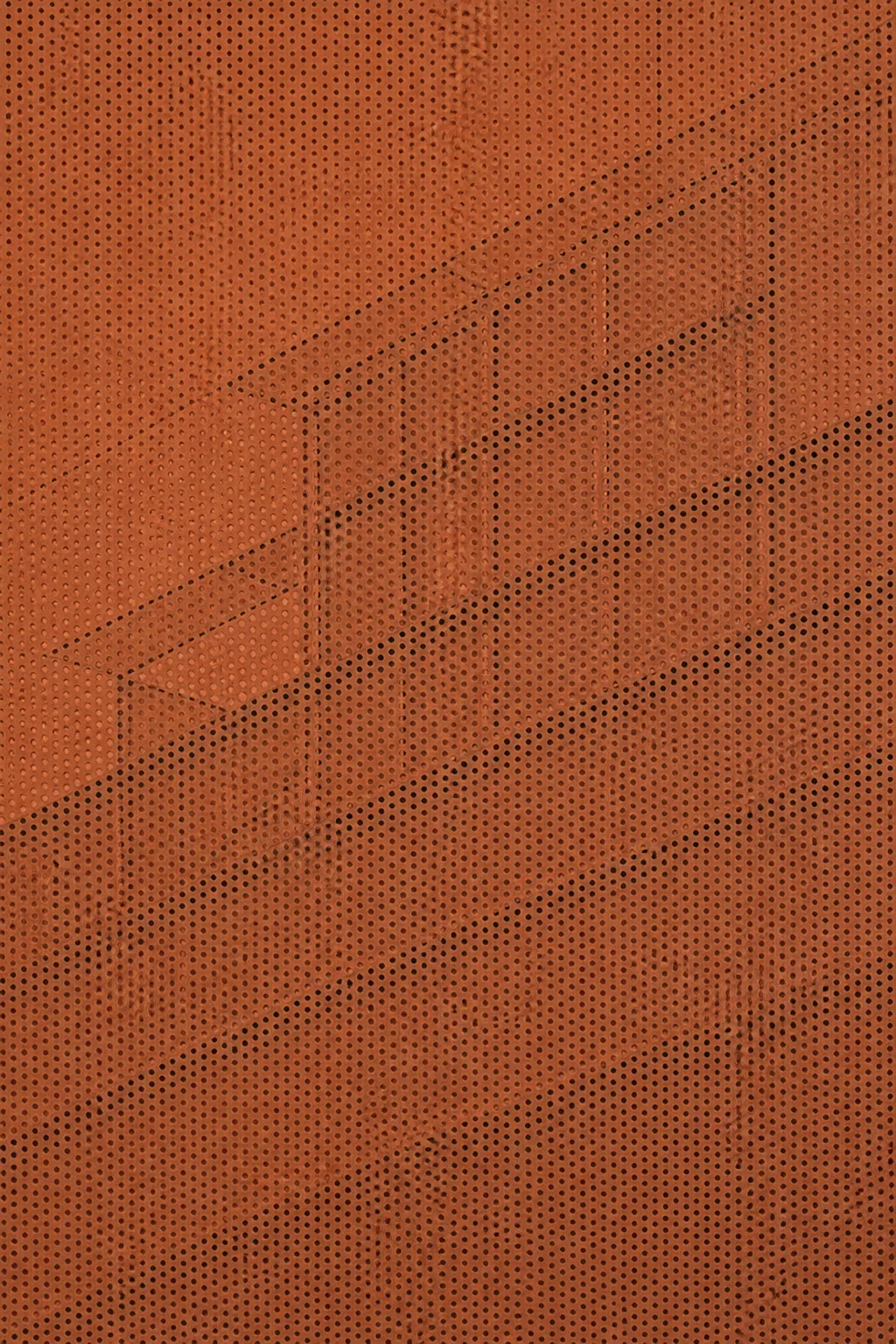Terracotta facade with a fine perforated pattern