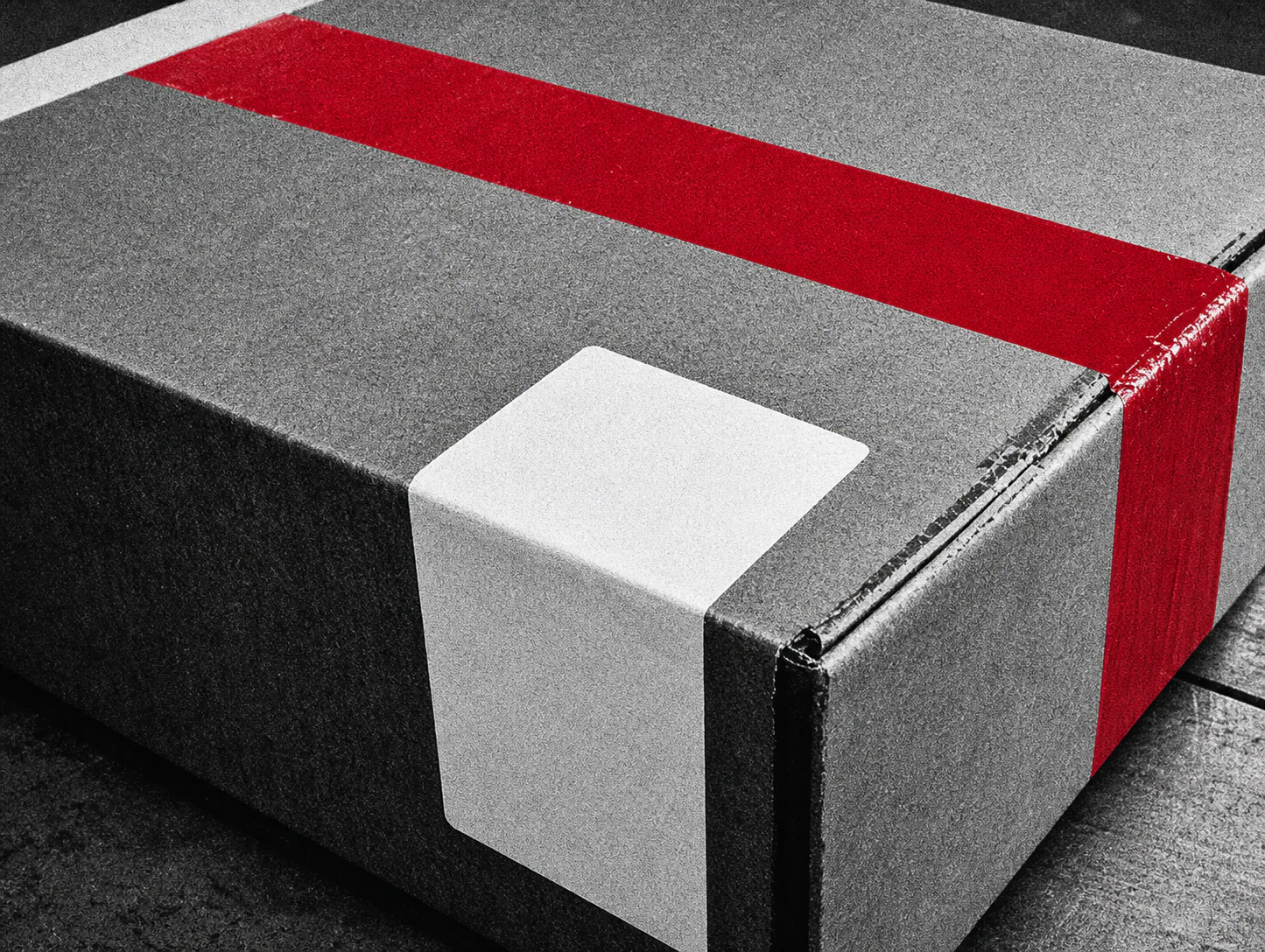 Field Parcel shipping box sealed with red tape