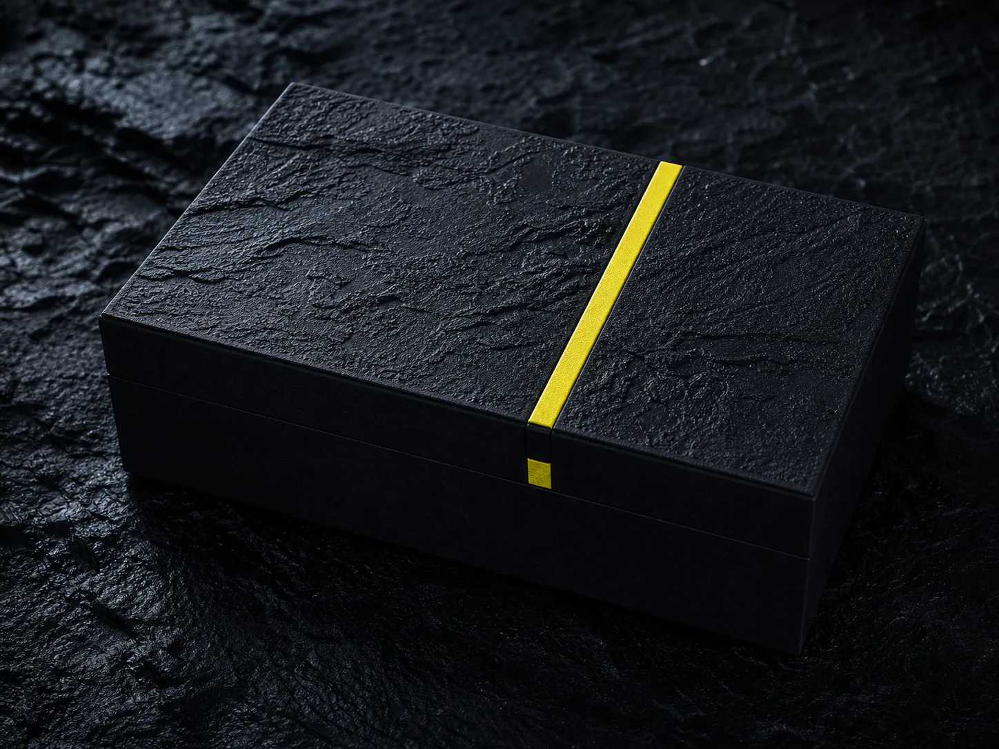 Textured black box with a yellow closure