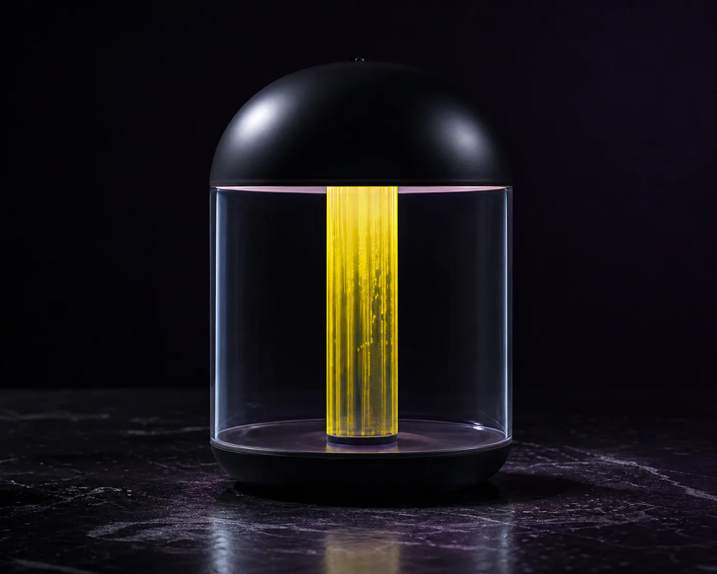 Black glass vessel with a bright yellow center detail