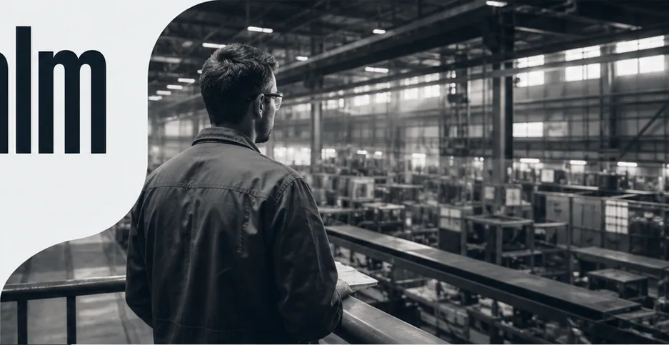 Operations lead looking across a busy, well-lit factory floor