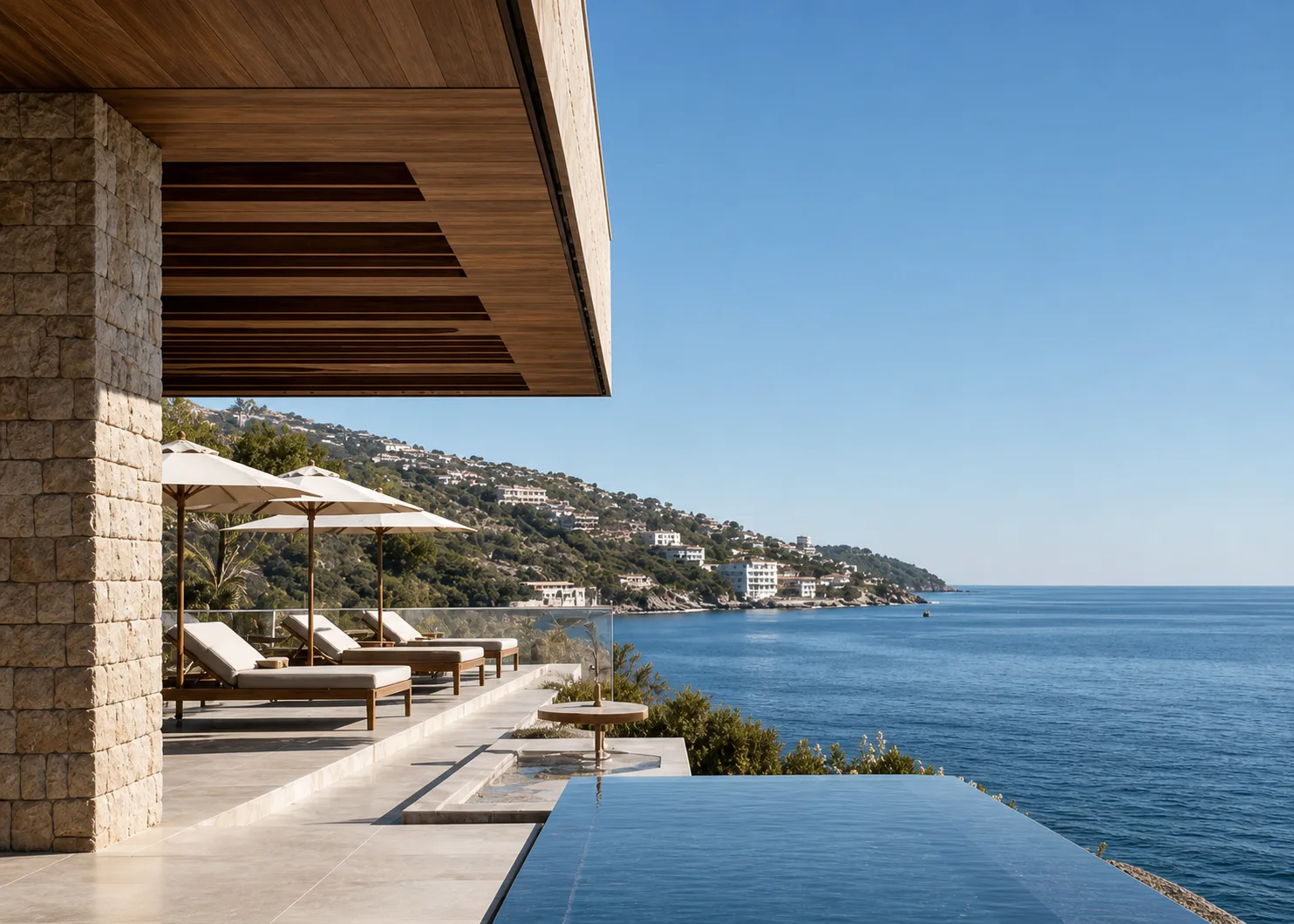 Modern coastal residence above an infinity pool