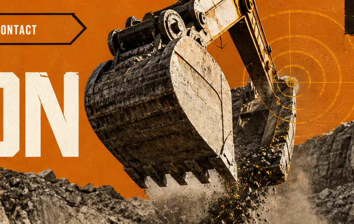 Excavator bucket lifting fractured rock at an open-pit mine