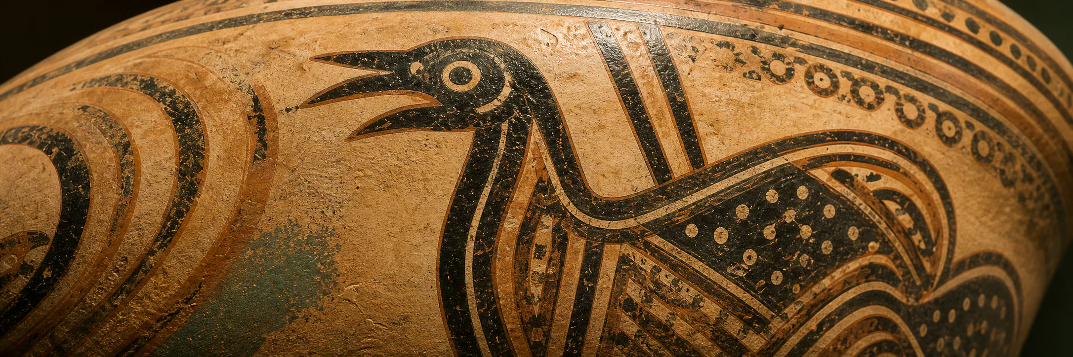 Painted ceramic vessel with a stylized bird and wave pattern