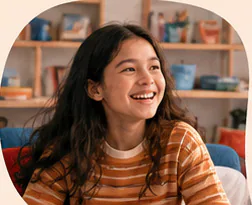 Two students laughing together at a creative workshop