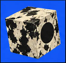 Marbled cube with a dark circular cutout