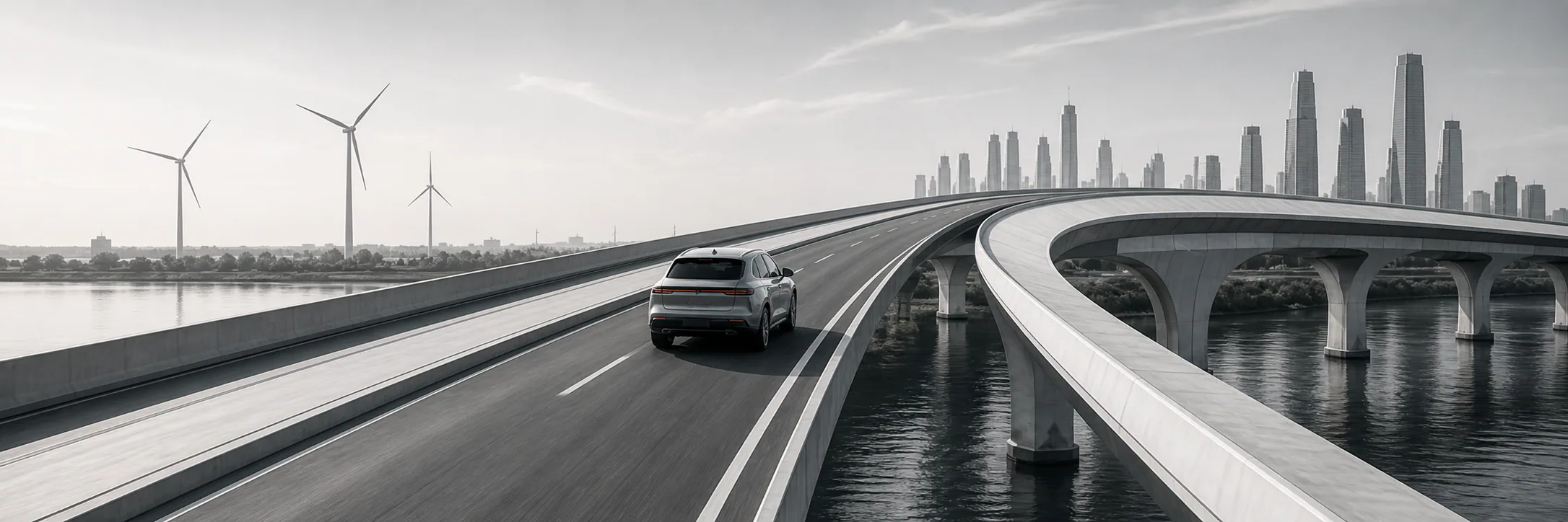 Aureline electric vehicle travelling across an elevated bridge toward the city