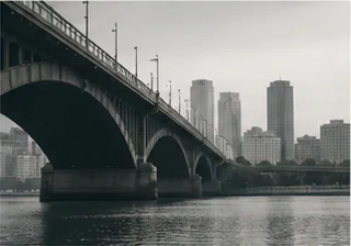 Bridge and city skyline viewed through morning haze