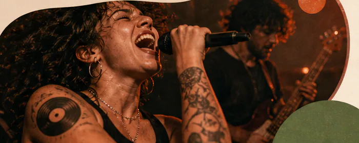 Singer performing into a microphone under warm stage lights