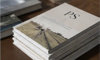 Stack of independent journals on an editorial desk