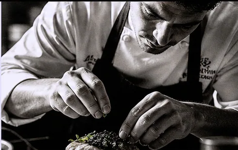 Chef finishing a dish during service