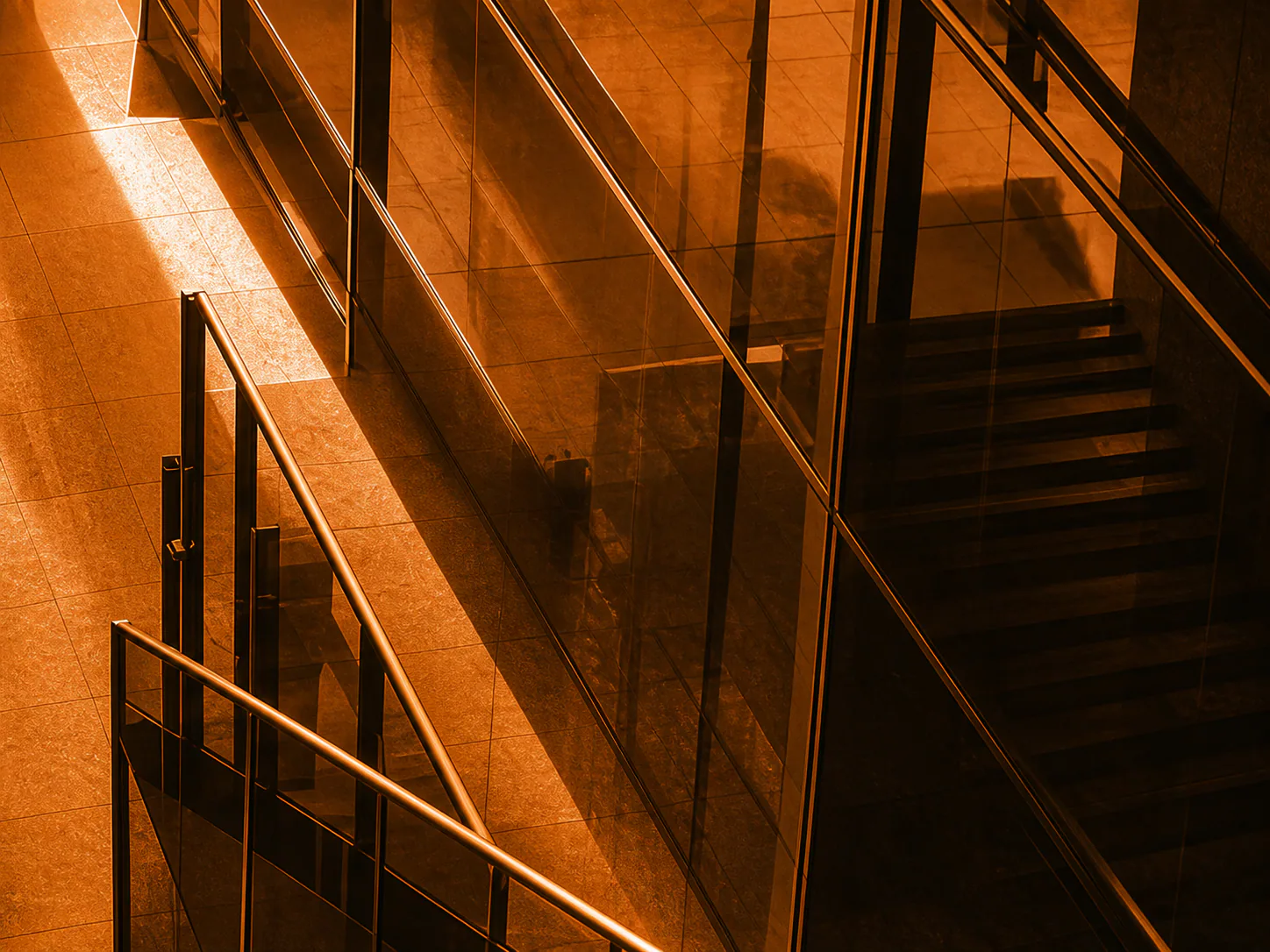 Geometric glass stairs inside a modern workplace